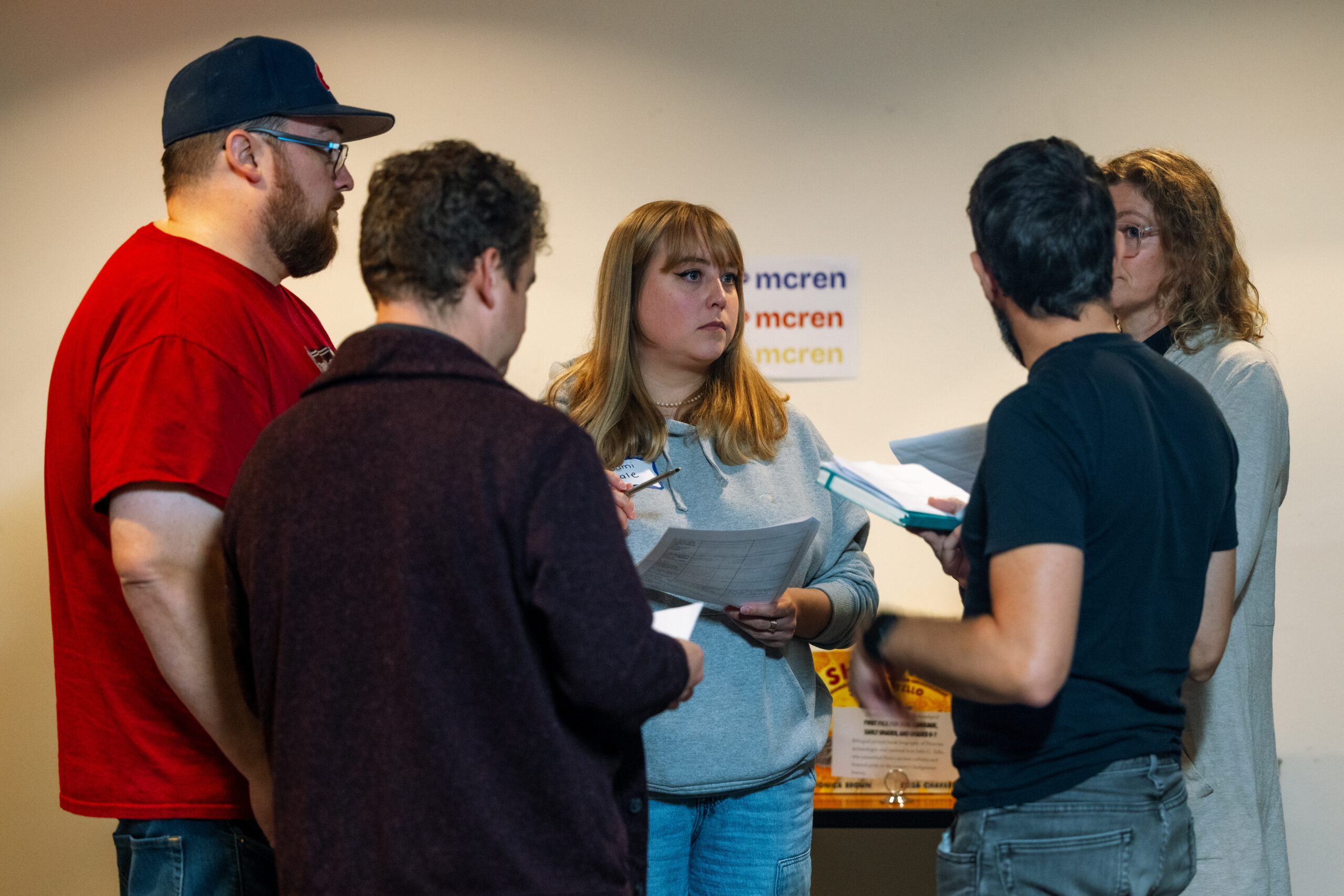 Photo of white man standing in front of a classroom whiteboard