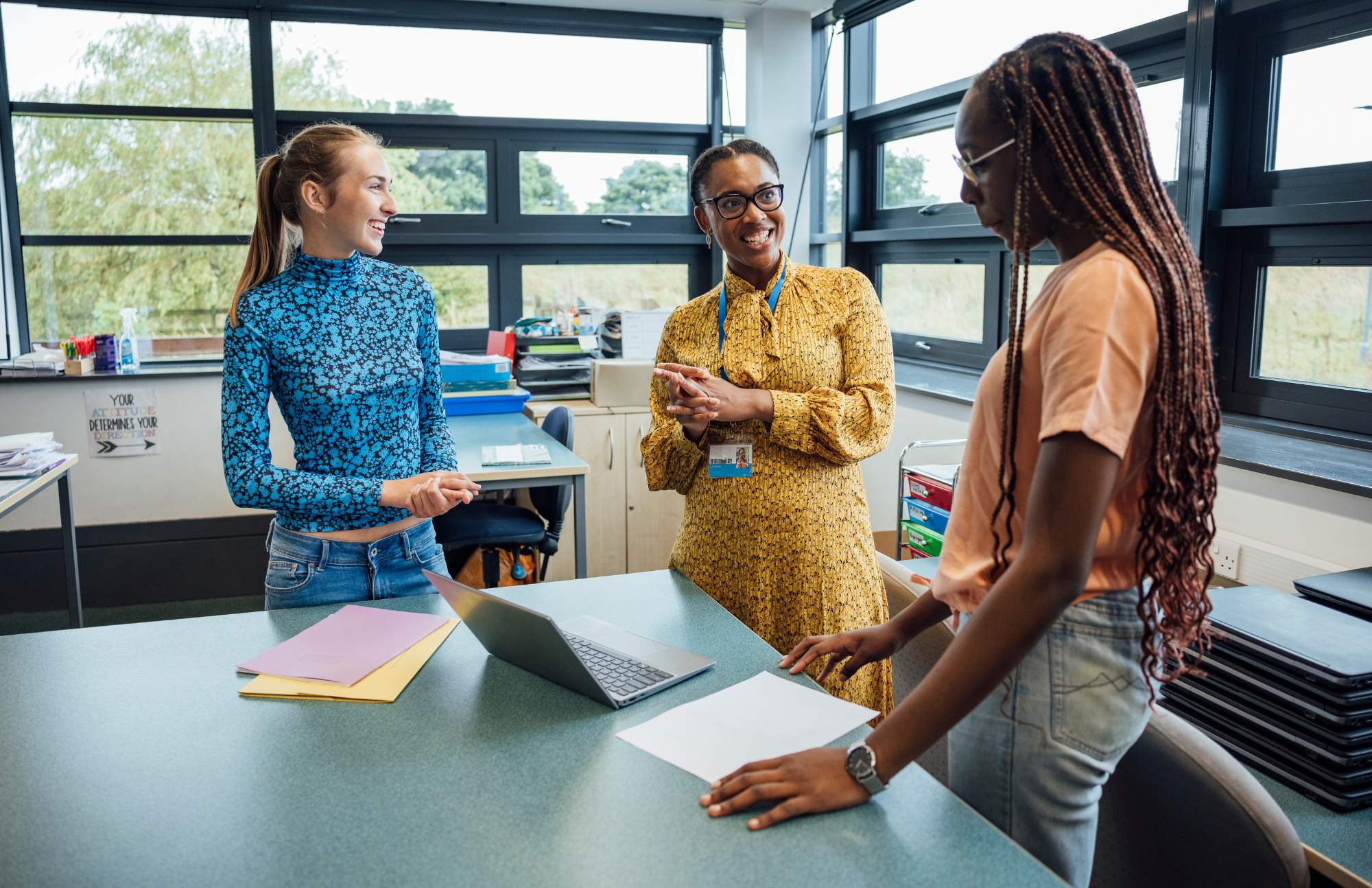 A principal in a classroom with two female students