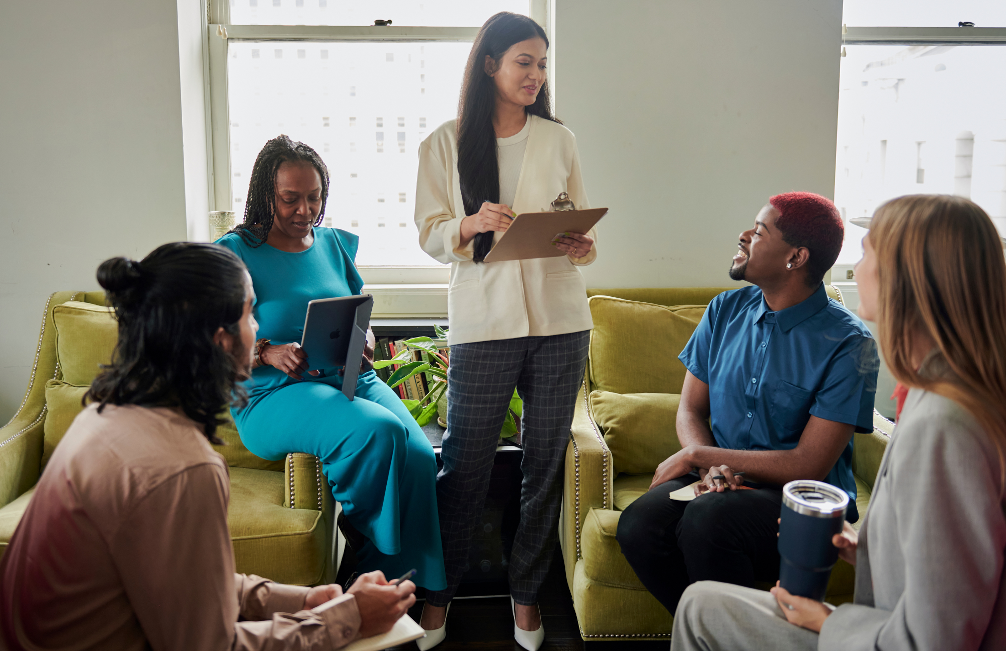 Photo of white man standing in front of a classroom whiteboard